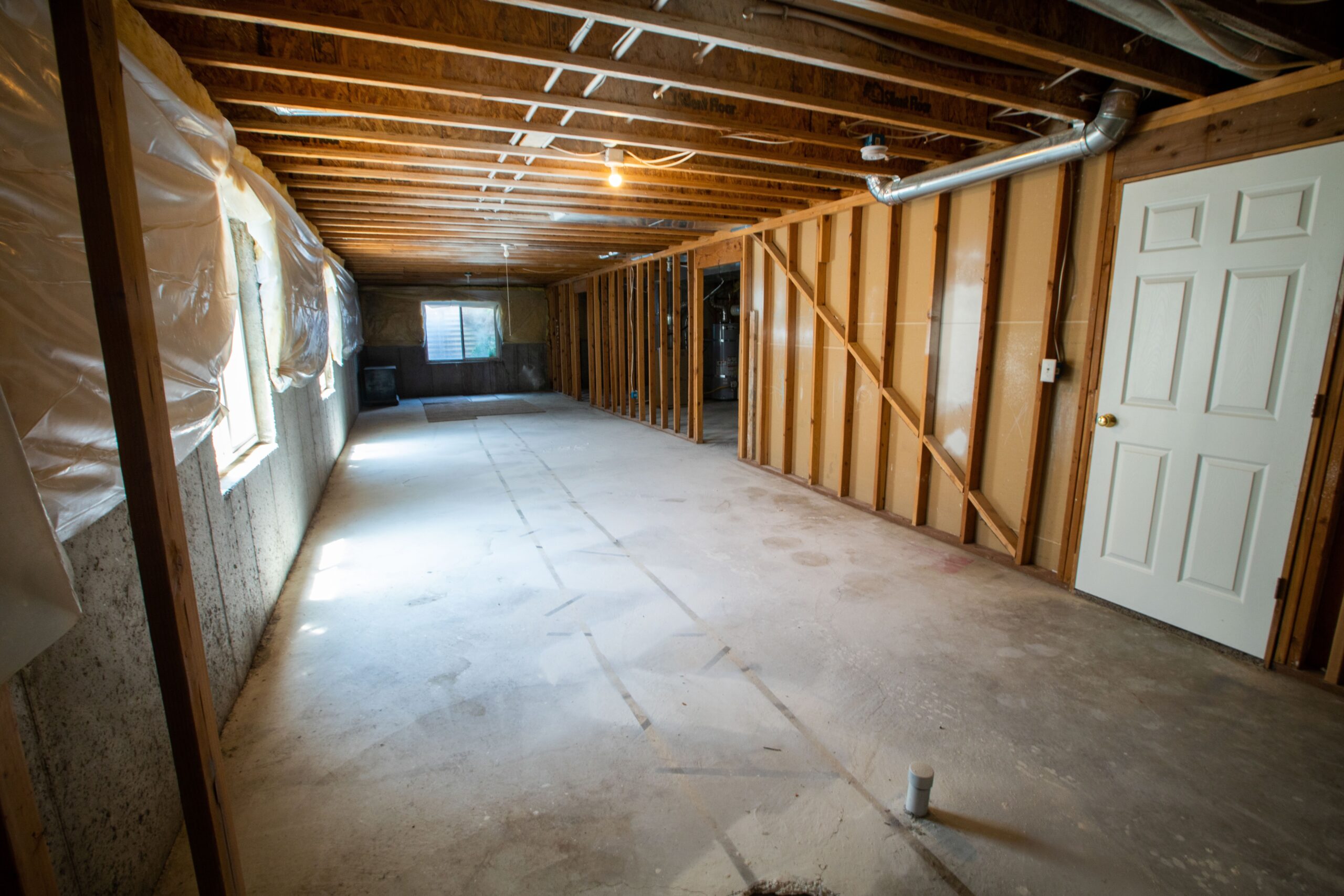Basement under Construction for Interior Waterproofing with Walls Exposed