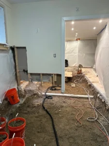 completely dug out half of the basement to install proper drainage-optimized