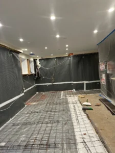 dimpled mat installed on walls to capture any potential leak-optimized