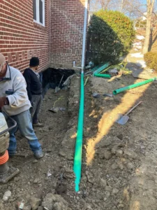 during backfill, piping for downspouts and proper compaction to minimize settlement-optimized